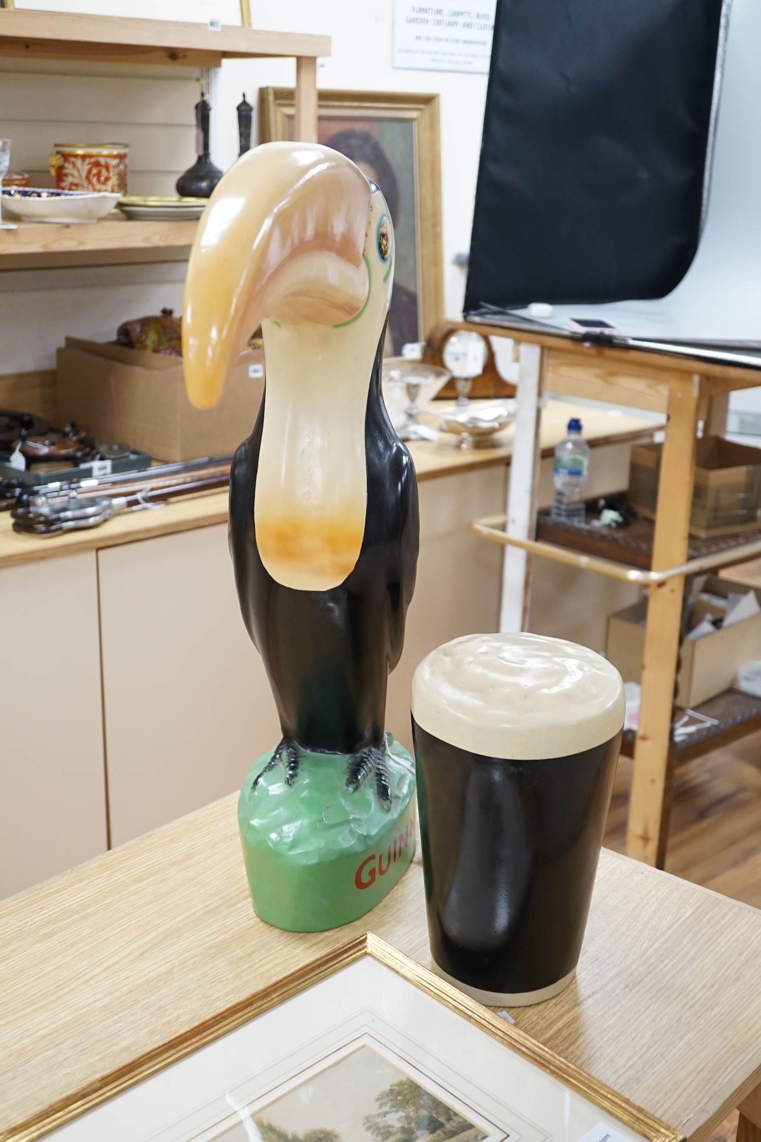 A large composition Guinness toucan, 66cm, and related pint ornament
